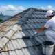 Professional roof painters from PremierPaintWorks repainting a residential roof in Auckland
