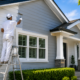 Professional house painters working on a modern home in Hauraki, Auckland