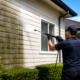 Professional Water Blasting service cleaning mould and dirt from a home's exterior in Auckland