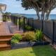 Professional deck and fence painting services for a coastal home in Castor Bay